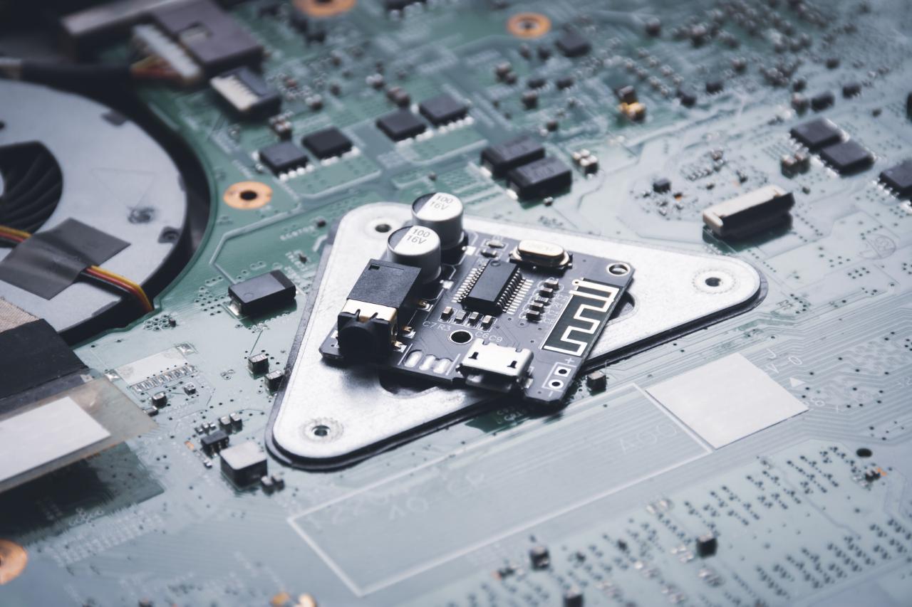 Photo of a small printed circuit board resting atop a larger board.